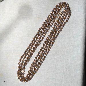 Gold and silver colored potato pearls. 104” strand